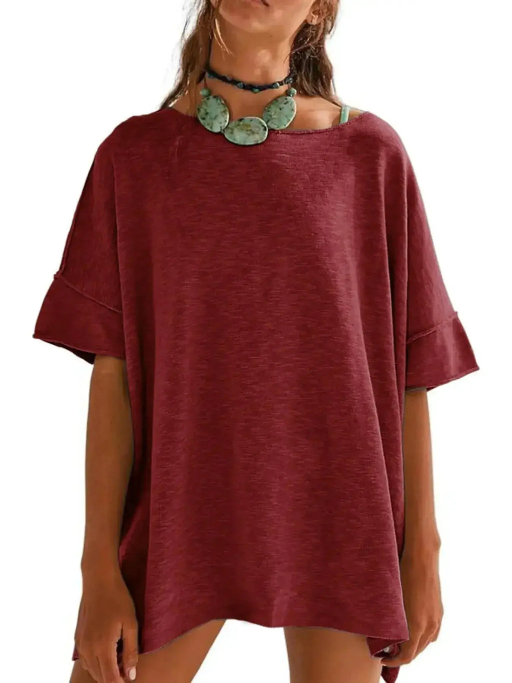 Women’s oversized drop-shoulder round neck T-shirt by Trendsi, relaxed casual style, soft fabric, and loose fit for everyday wear.
