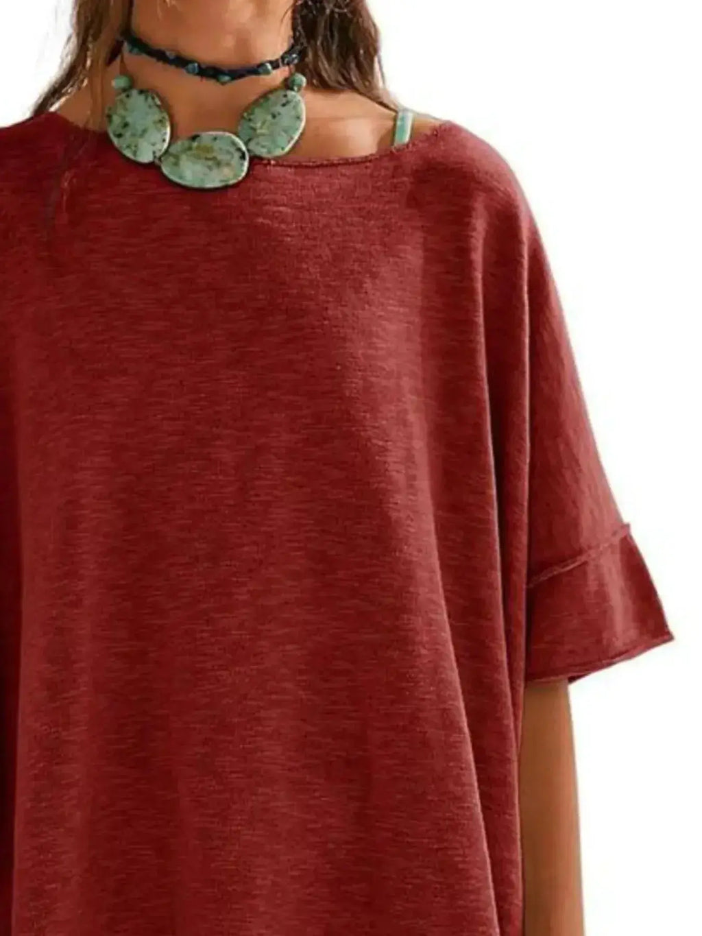 Women’s oversized drop-shoulder round neck T-shirt by Trendsi, relaxed casual fit, soft fabric, and comfortable everyday style.