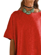 Women’s oversized drop-shoulder round neck T-shirt by Trendsi, relaxed casual fit, soft fabric, and stylish relaxed design.