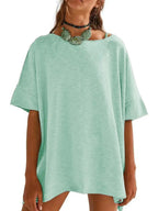 Women’s oversized drop-shoulder round neck T-shirt by Trendsi, relaxed casual fit, soft fabric, and stylish relaxed design.