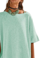 Women's oversized drop-shoulder round neck T-shirt by Trendsi, relaxed casual fit, soft fabric, and comfortable everyday style.