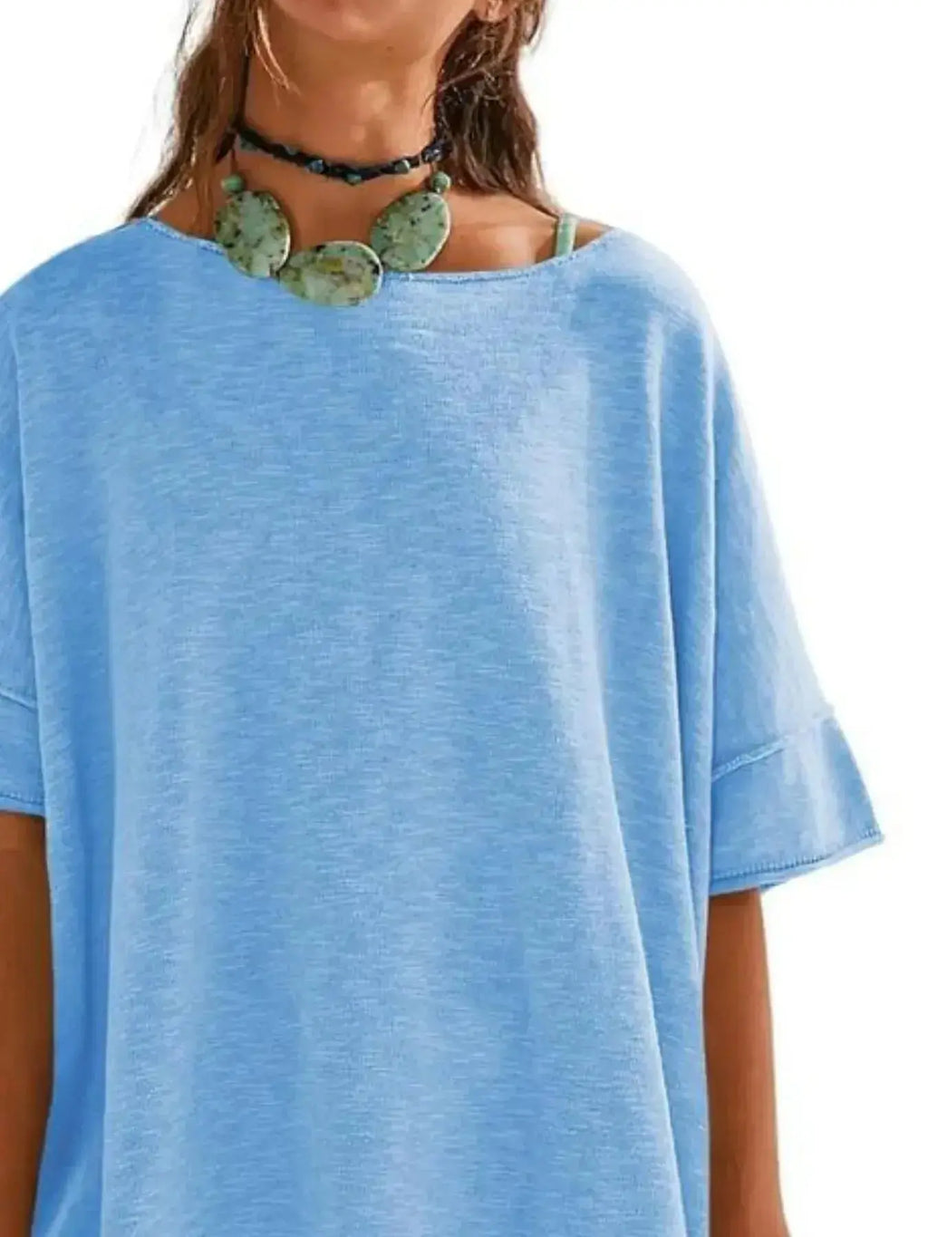 Women’s oversized drop-shoulder round neck T-shirt by Trendsi, relaxed casual fit, soft fabric, worn as a stylish everyday tee.