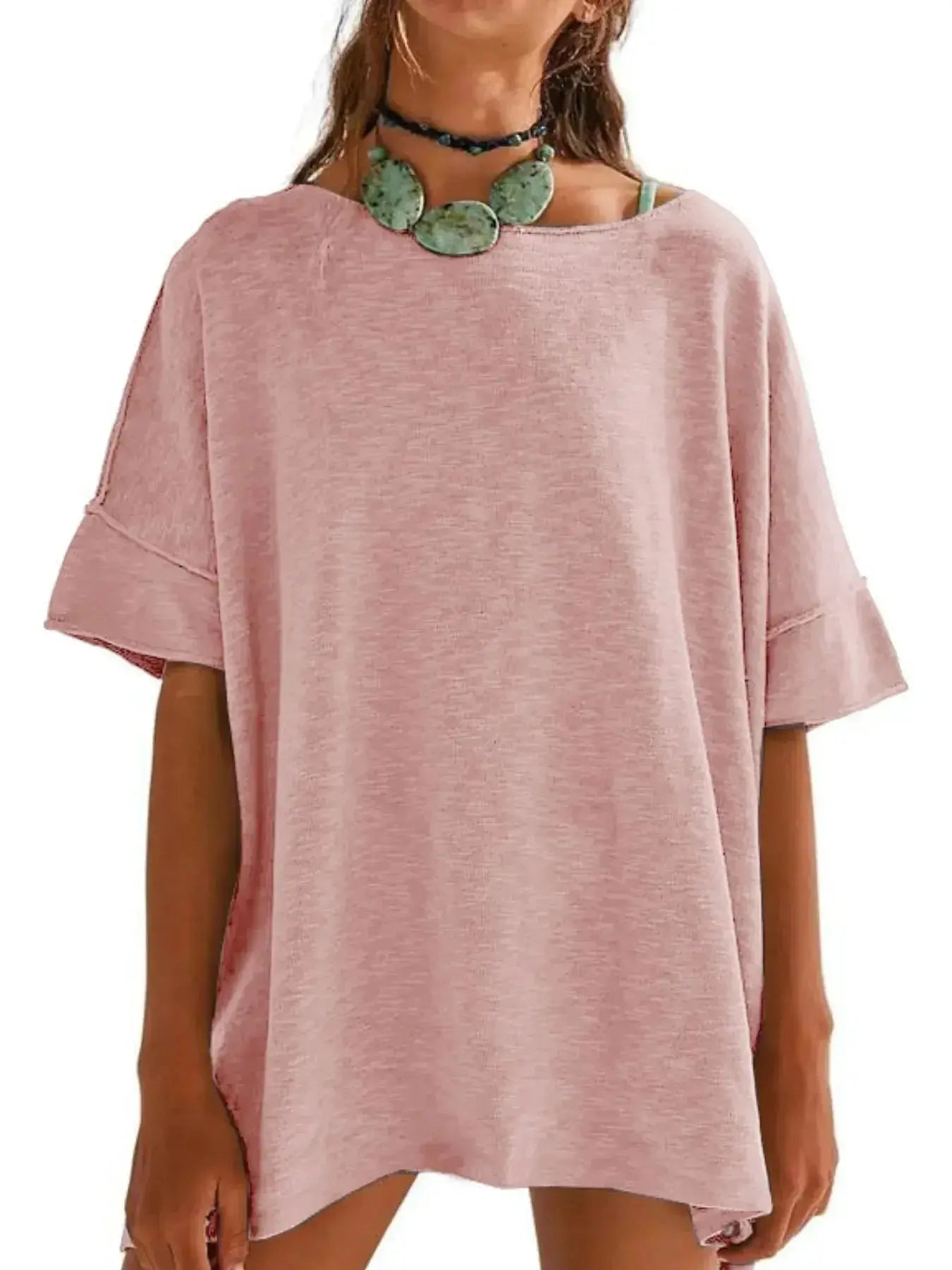 Women’s oversized drop-shoulder round neck casual T-shirt by Trendsi, relaxed fit with soft fabric and relaxed style.