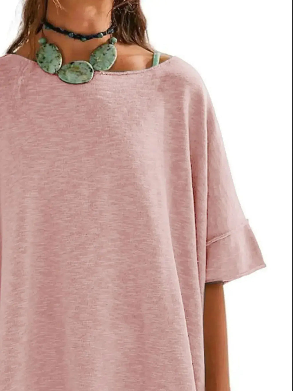 Women's oversized drop-shoulder round neck T-shirt by Trendsi, relaxed casual style, soft fabric, and comfortable fit.