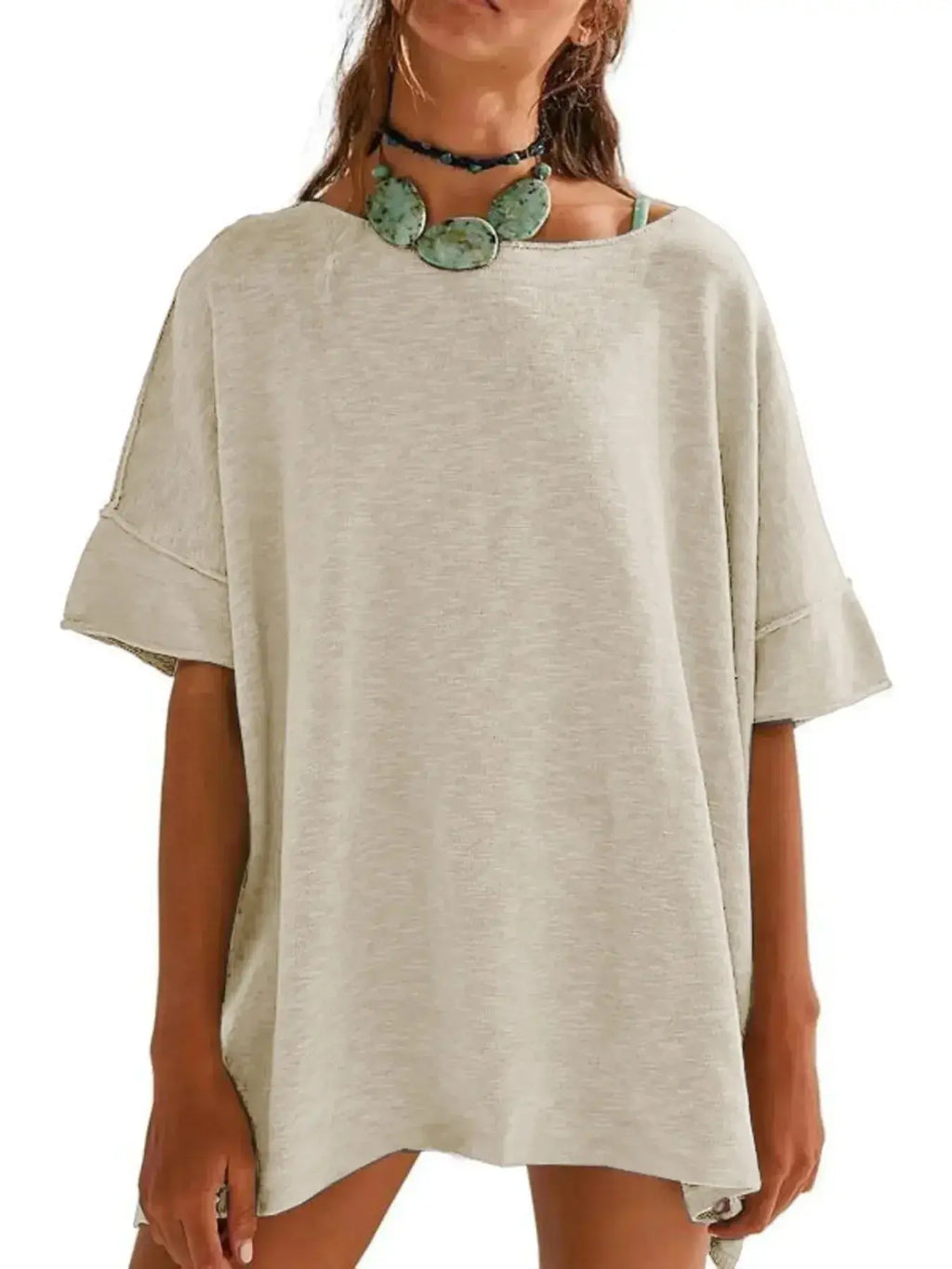 Women’s oversized drop-shoulder round neck T-shirt by Trendsi, relaxed casual fit, soft fabric, worn as a stylish everyday tee.