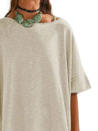 Women’s oversized drop-shoulder round neck T-shirt by Trendsi, featuring a relaxed casual fit and soft fabric.