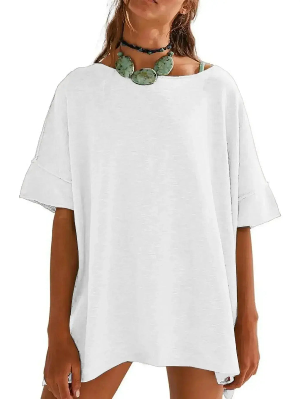 Women’s oversized drop-shoulder round neck T-shirt by Trendsi, relaxed casual fit, soft fabric, worn as a stylish everyday tee.