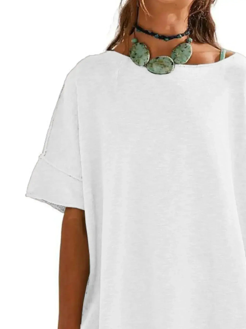 Women’s oversized drop-shoulder round neck T-shirt by Trendsi, relaxed casual fit, soft fabric, displayed on a model.
