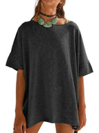 Women’s oversized drop-shoulder round neck T-shirt by Trendsi, relaxed casual fit, soft fabric, and stylish relaxed silhouette.