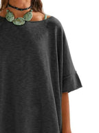 Women's oversized drop-shoulder round neck T-shirt by Trendsi, relaxed casual fit, soft fabric, and stylish design.