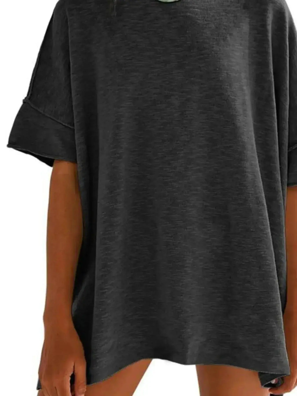 Women’s oversized drop-shoulder round neck T-shirt by Trendsi, relaxed casual fit, soft fabric, and stylish design.