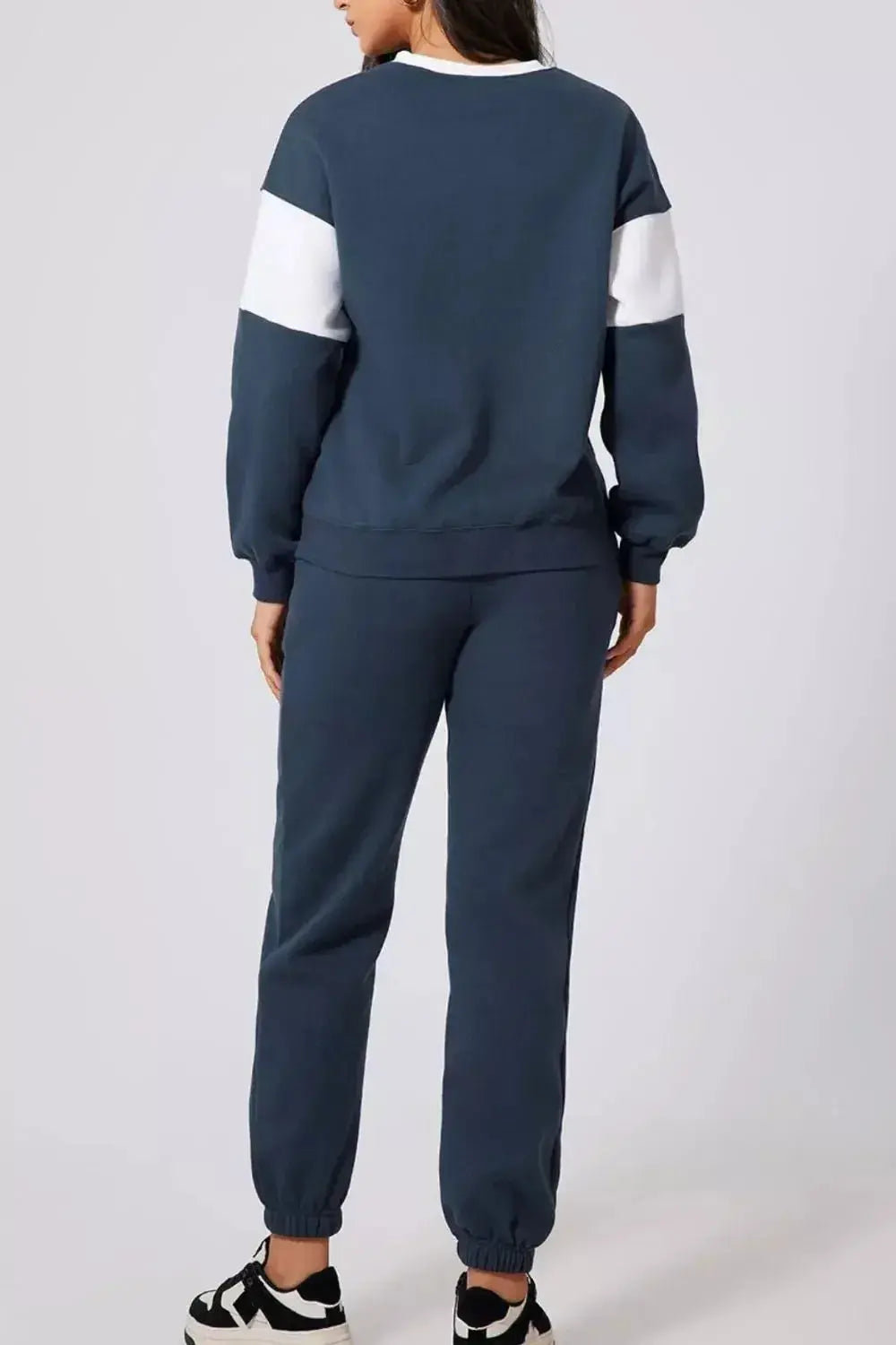 Women wearing Plush Fashion Hub oversized drop shoulder sweatshirt and joggers loungewear set, casual and comfortable outfit.