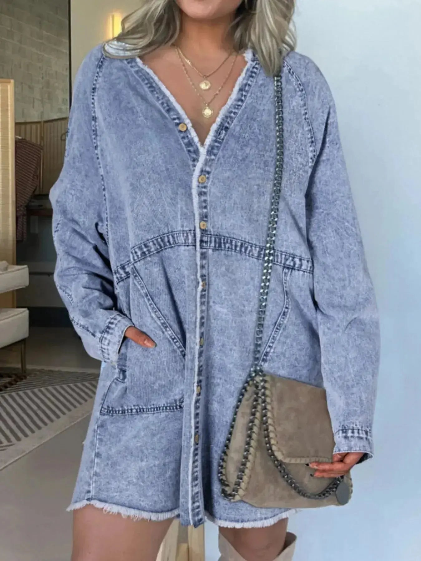 Women’s oversized denim shirt dress with long sleeves and front pockets, stylish casual wear by Plush Fashion Hub.