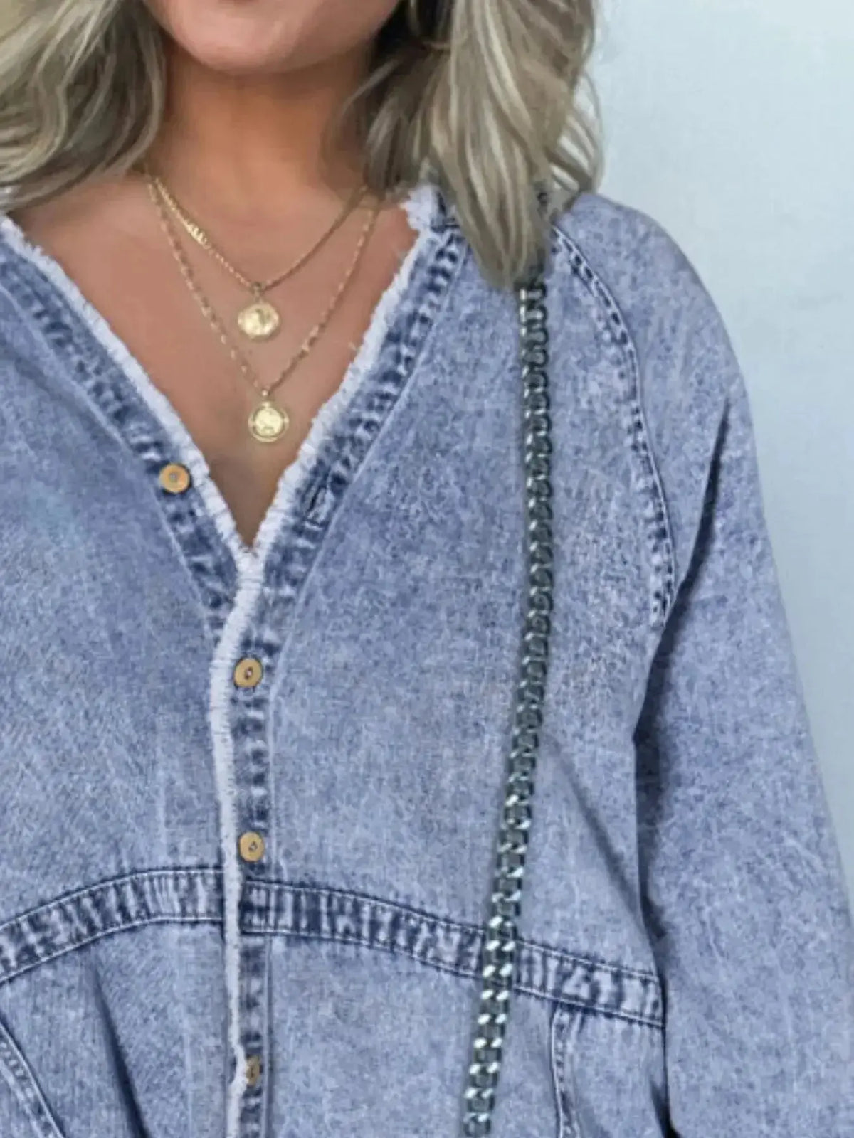 Women’s oversized long sleeve denim shirt dress with pockets, from Plush Fashion Hub, shown on a model with a casual style.