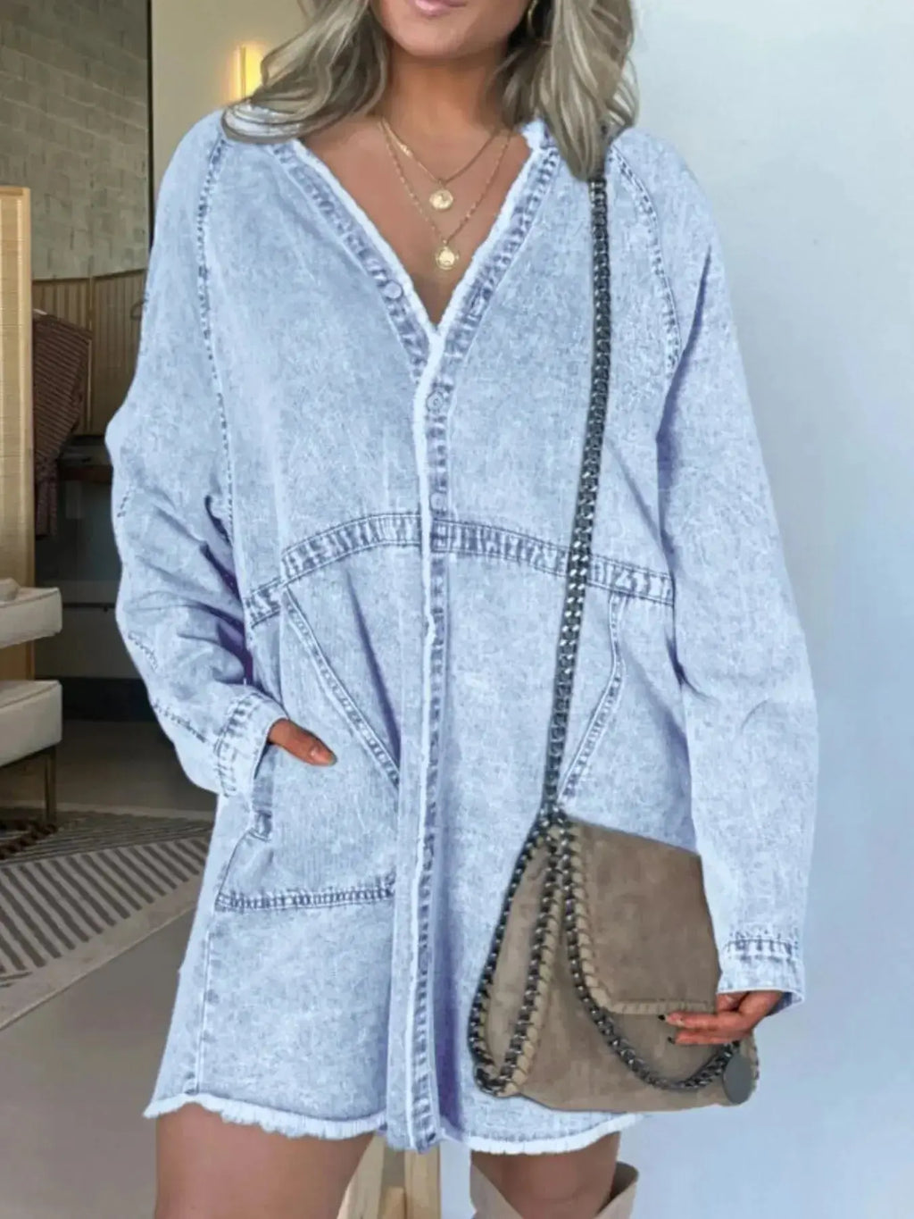 Women’s oversized long sleeve denim shirt dress with pockets, stylish casual denim dress by Trendsi, showing front view with pockets.