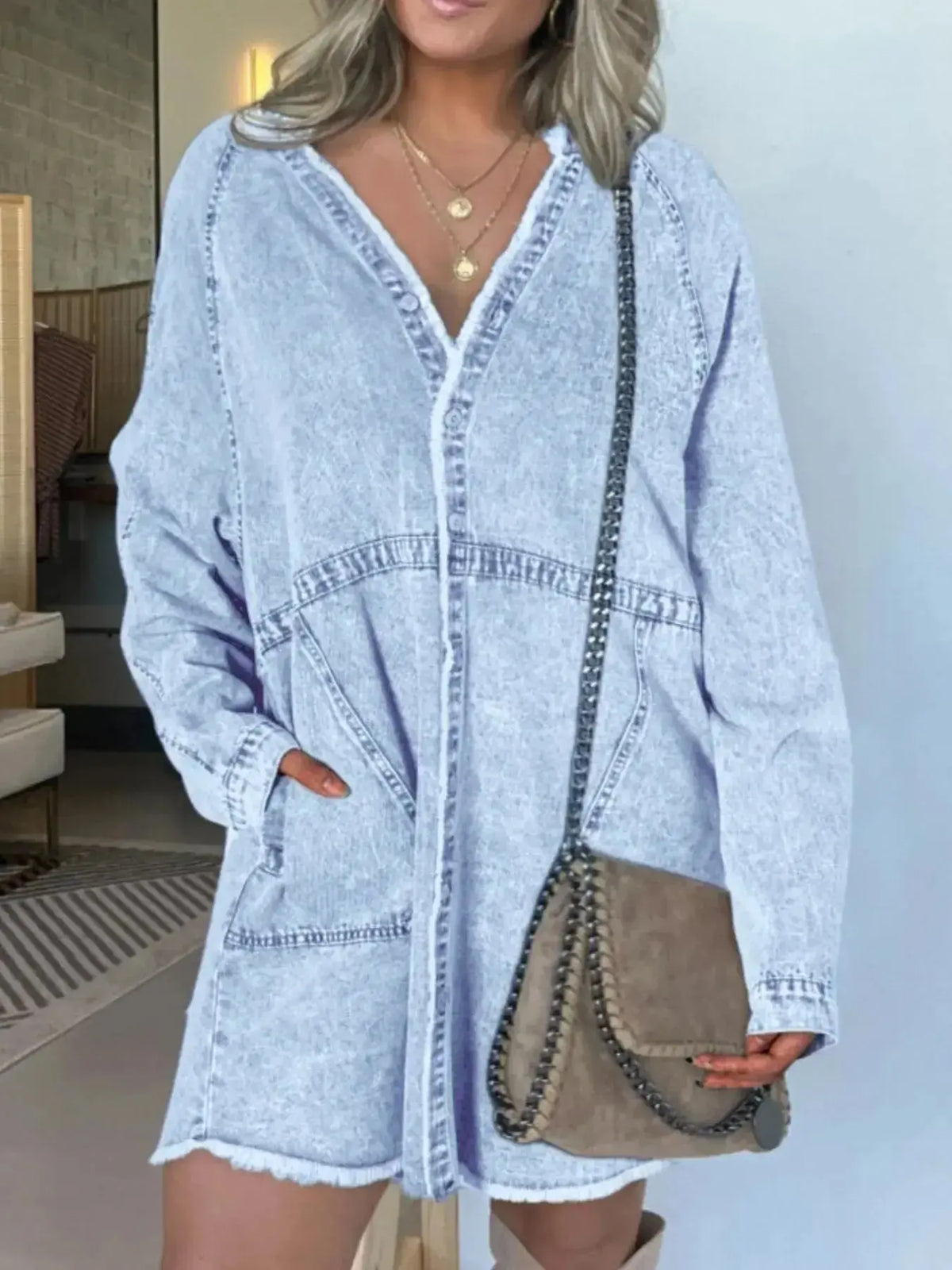 Women wearing Plush Fashion Hub oversized denim shirt dress with long sleeves and front pockets, casual and stylish winter outfit.