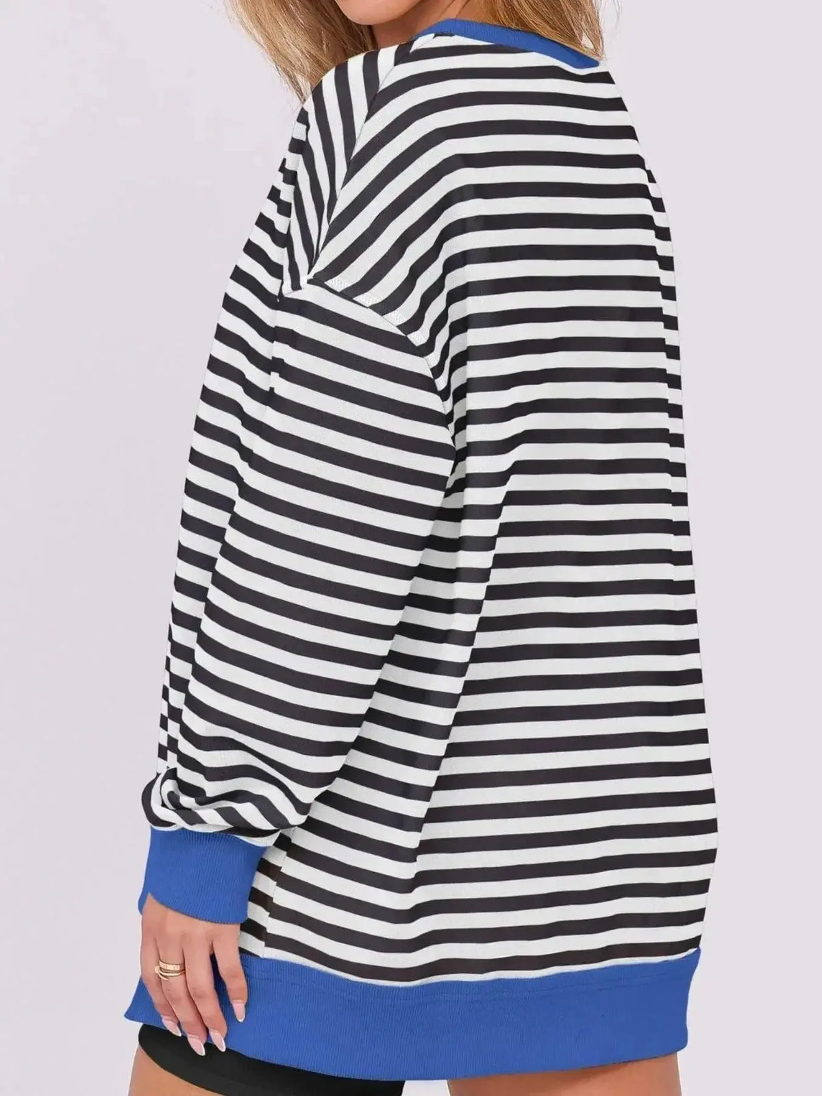 Women’s oversized notched neck sweatshirt by Plush Fashion Hub with contrast stitching and relaxed fit, shown on a model.