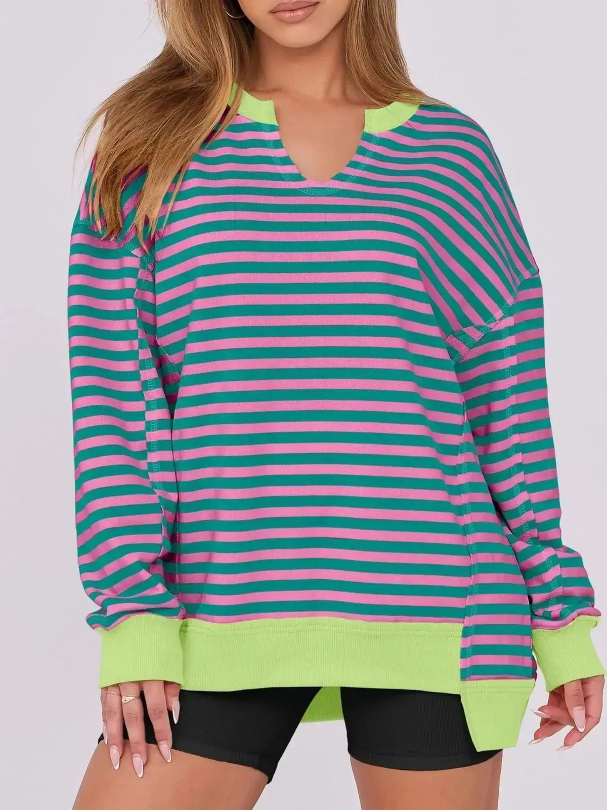 Women’s oversized notched neck sweatshirt with contrast stitching, plush fabric, and relaxed fit from Plush Fashion Hub.