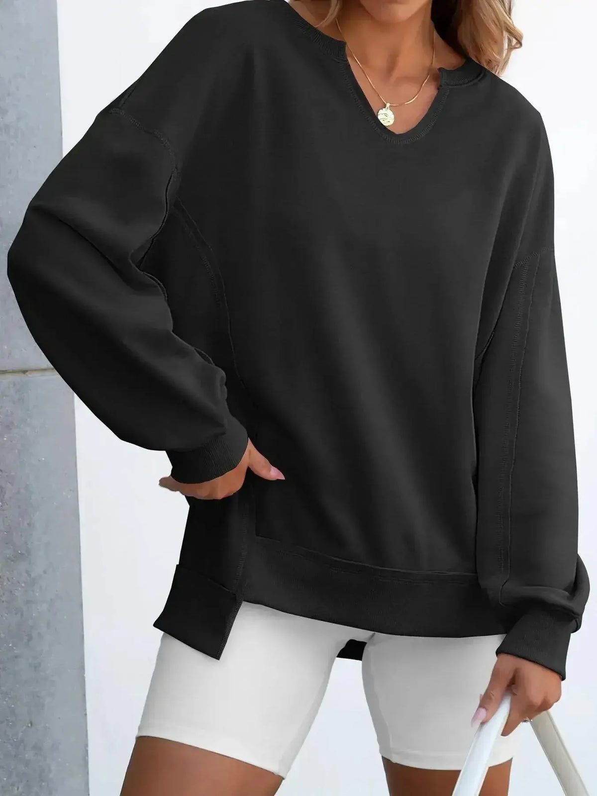 Women’s oversized notched neck sweatshirt by Plush Fashion Hub with contrast stitching, featuring a relaxed fit and stylish design.