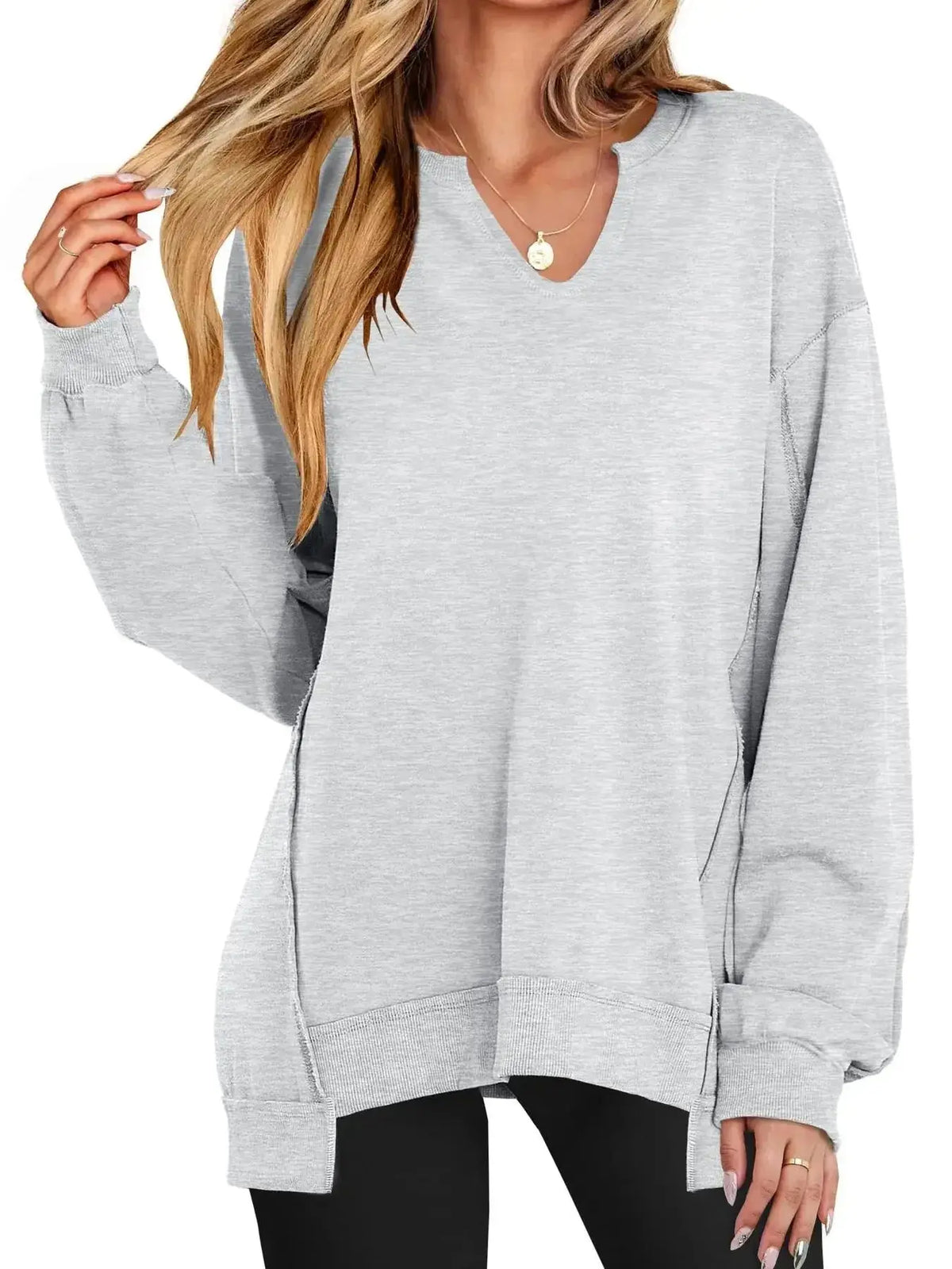 Women’s oversized notched neck sweatshirt with contrast stitching by Plush Fashion Hub, featuring a relaxed fit and stylish design.
