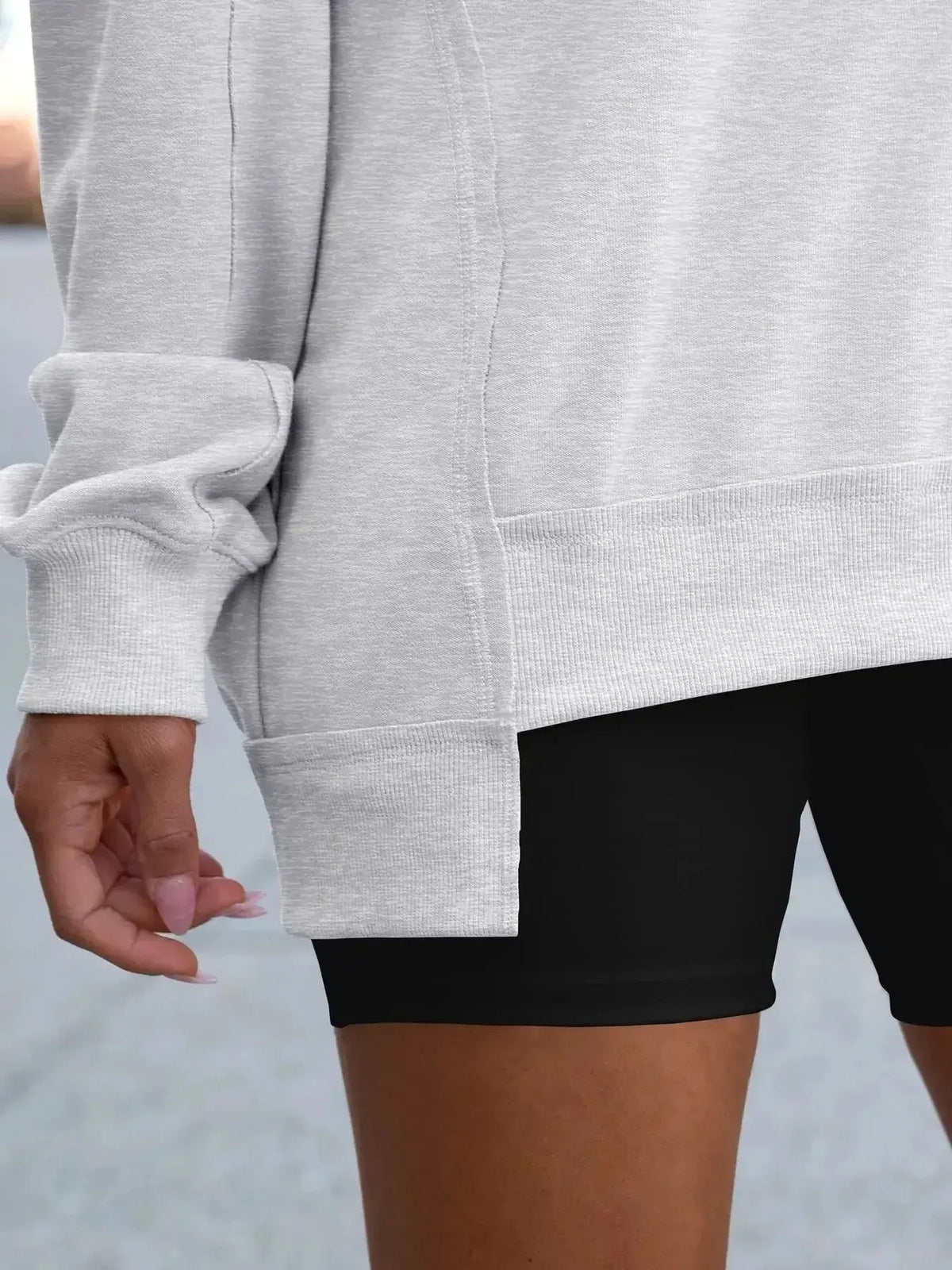 Women’s oversized sweatshirt with notched neckline and contrast stitching, stylish sweater by Plush Fashion Hub.