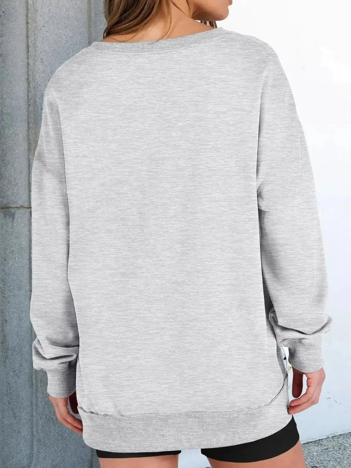 Women’s oversized notched neck sweatshirt with contrast stitching, from Plush Fashion Hub, casual sweater with relaxed fit and stylish details.