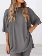 Women's oversized round neck loungewear set by Trendsi, featuring a comfy two-piece shirt and matching lounge pants.