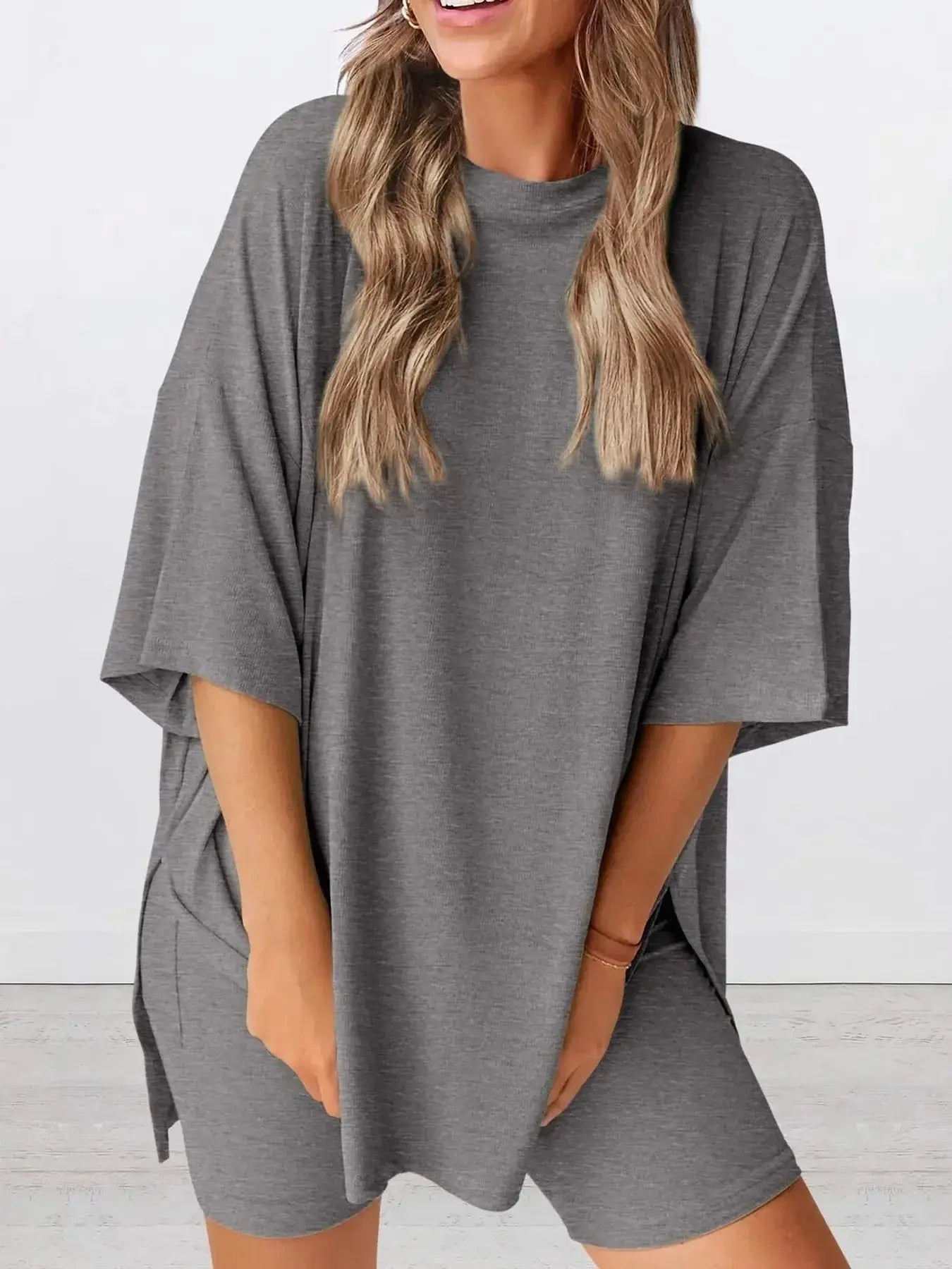 Women's oversized round neck loungewear set by Trendsi, featuring a comfortable two-piece cotton shirt and matching lounge pants.
