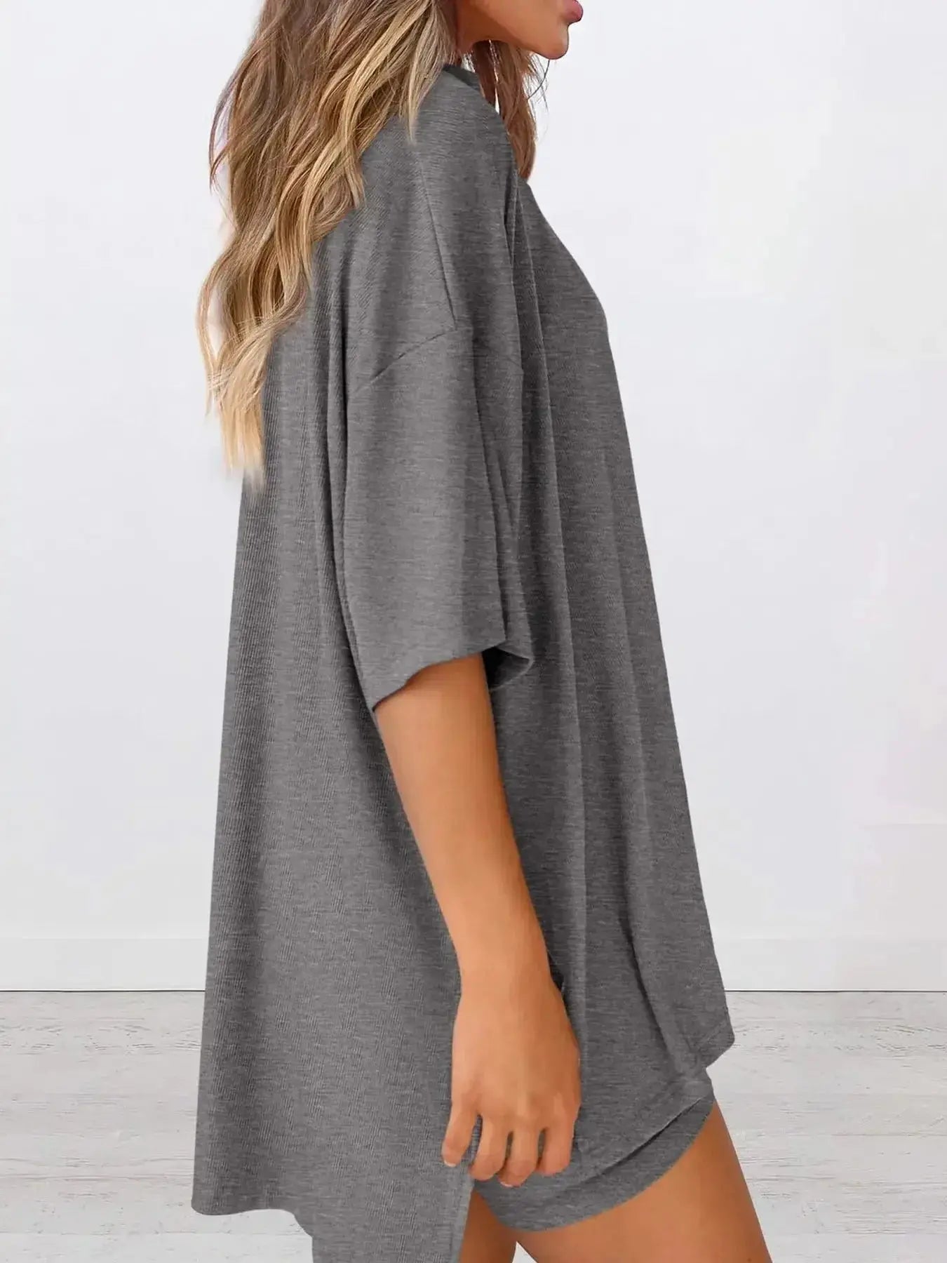 Women’s oversized round neck loungewear shirt from Trendsi, soft and comfortable two-piece lounge set for relaxed wear.
