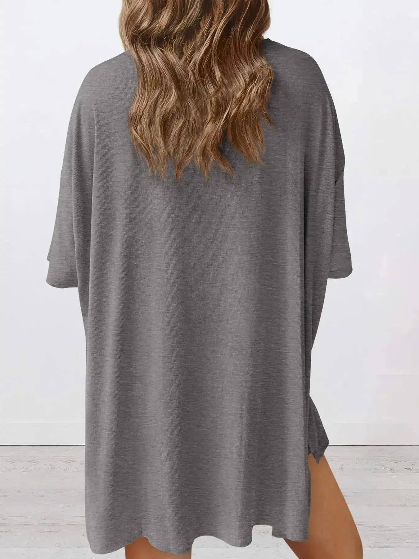 Women's oversized round neck loungewear set from Trendsi, featuring a comfortable two-piece lounge shirt and matching pants.