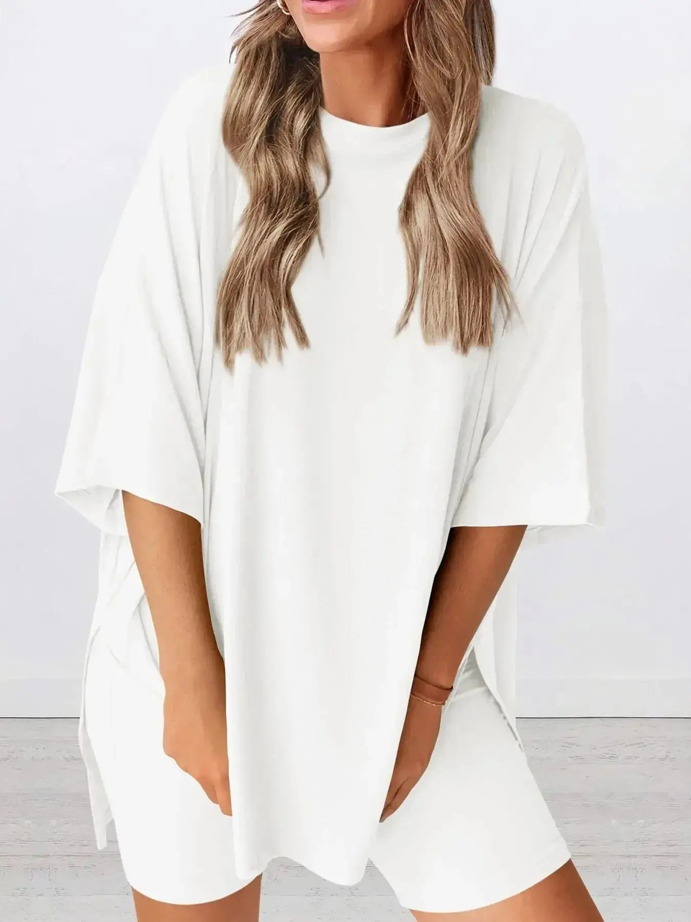 Women's oversized round neck loungewear set by Trendsi, featuring a comfy two-piece shirt and lounge set for relaxed wear.