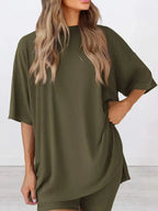 Women’s oversized round neck loungewear set by Trendsi, featuring a comfortable two-piece shirt and lounge pant for relaxed wear.