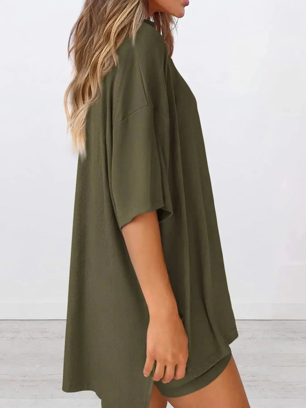 Women’s oversized round neck loungewear shirt by Trendsi, comfortable two-piece lounge set for cozy relaxation.