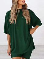 Women's oversized round neck loungewear set by Trendsi, featuring a comfortable two-piece lounge shirt and matching bottom.