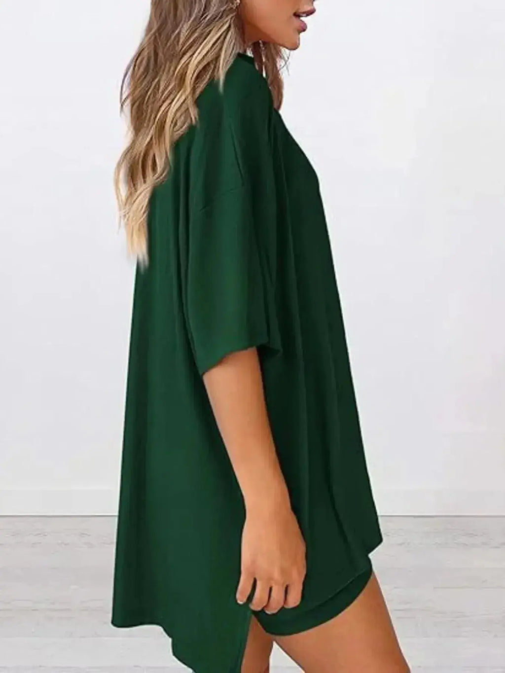 Women’s oversized round neck loungewear shirt from Trendsi, part of a comfy two-piece lounge set, made of soft, cozy fabric.