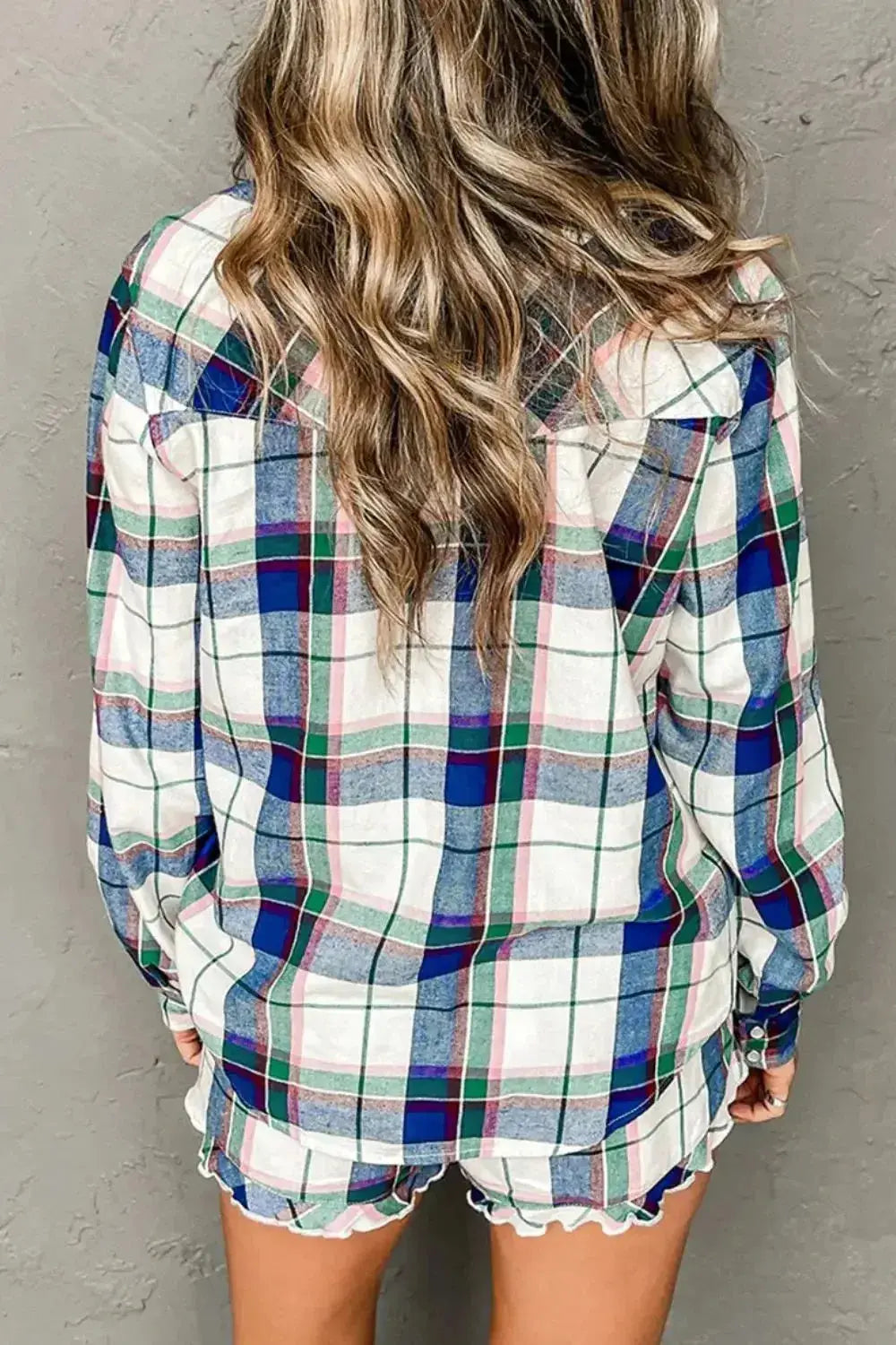 Women’s plaid long sleeve lounge set with snap-down top and shorts, trendy pajamas by Trendsi, comfortable and stylish for relaxing.