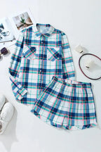 Women's plaid long sleeve pajama lounge set with snap-down top and shorts, by Trendsi, featuring cozy, relaxed sleepwear style.