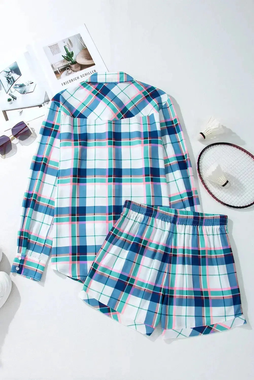 Women's plaid long sleeve pajama lounge set with snap-down top and shorts by Trendsi, featuring a cozy, stylish design.
