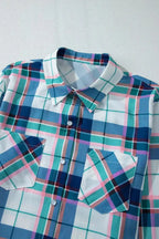 Women's plaid long sleeve pajama lounge set with snap-down top and shorts, perfect for comfortable sleepwear by Trendsi