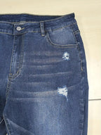 Plus size distressed slim fit jeans with raw hem from Trendsi, showing the stylish fit and frayed denim details.