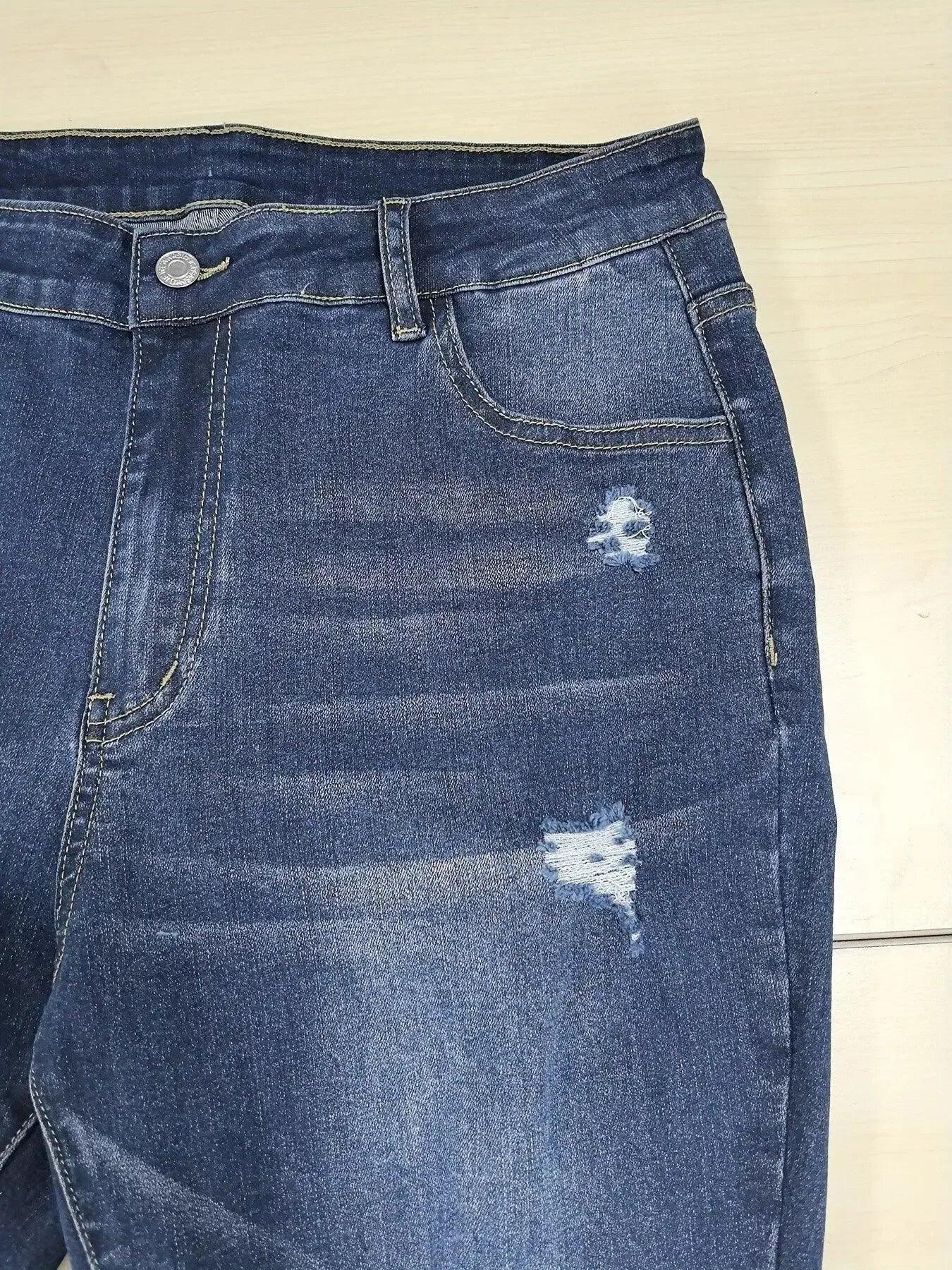 Plus size distressed slim fit jeans with raw hem from Trendsi, showing the stylish fit and frayed denim details.