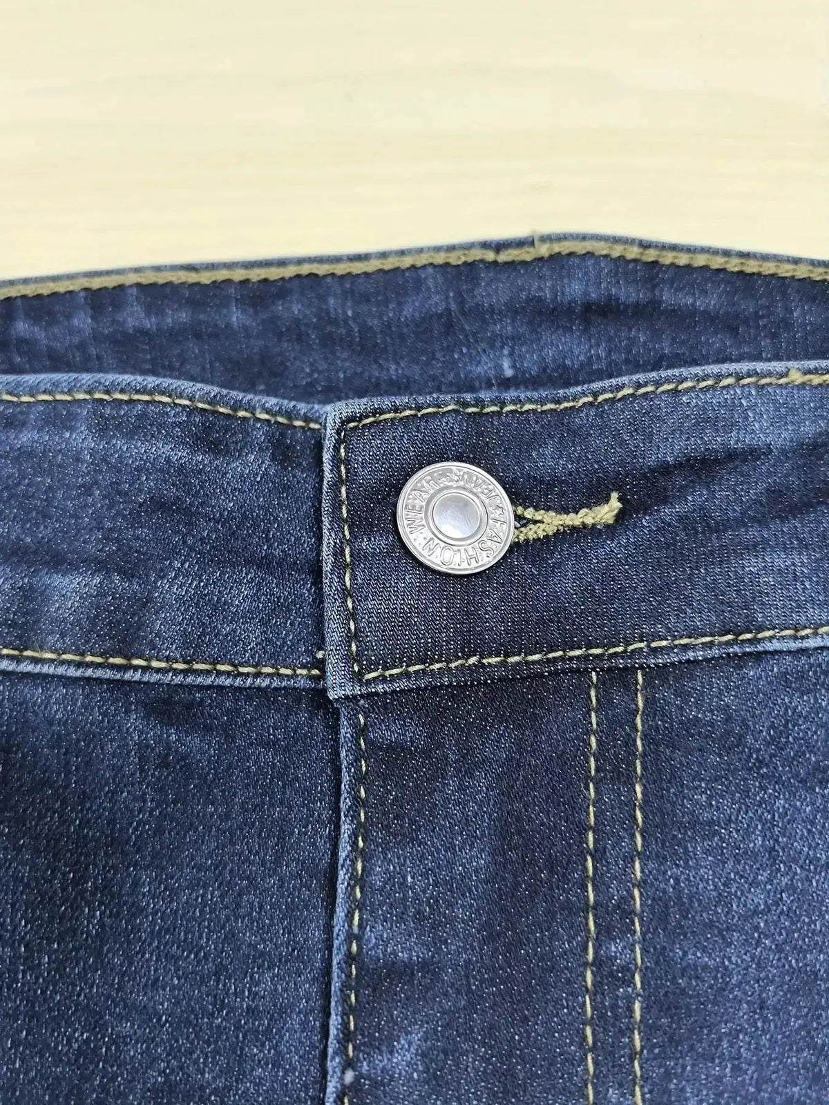 Plus size women's distressed slim fit jeans with raw hem from Plush Fashion Hub, showcasing a trendy, casual denim look.
