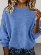 Plus size women's relaxed fit sweater with dropped shoulders and round neckline, casual and comfortable from Trendsi.