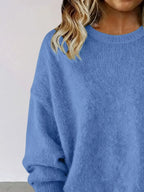 Plus size women's relaxed fit sweater with dropped shoulders and round neck, by Trendsi, shown in a cozy knit style.