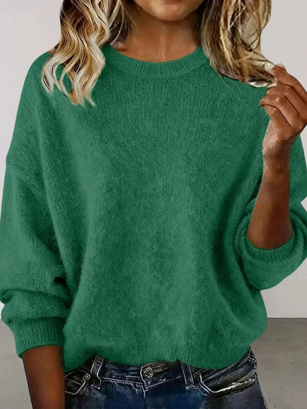 Plus size women's relaxed fit sweater with dropped shoulders and round neckline from Trendsi, styled for casual comfort.