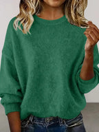 Plus size women's relaxed fit sweater with dropped shoulders and round neckline from Trendsi, styled for casual comfort.