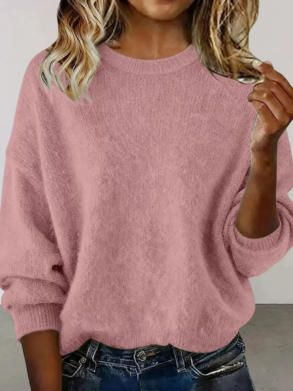 Plus size women's relaxed fit sweater with dropped shoulders and round neck, stylish and comfortable from Trendsi.