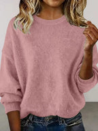 Plus size women's relaxed fit sweater with dropped shoulders and round neck, stylish and comfortable from Trendsi.