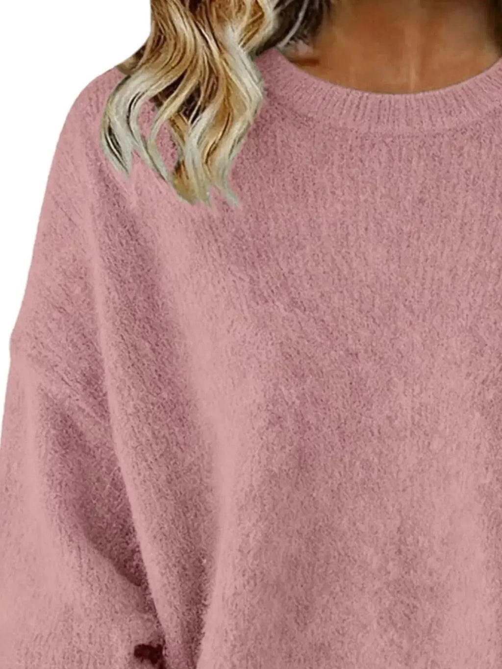 Plus size women's relaxed fit sweater with dropped shoulders and round neckline, stylish and comfortable from Trendsi.