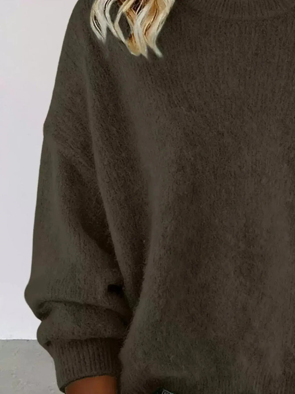 Plus size women's relaxed fit sweater with dropped shoulders and round neck, by Trendsi, shown in a casual, cozy style.